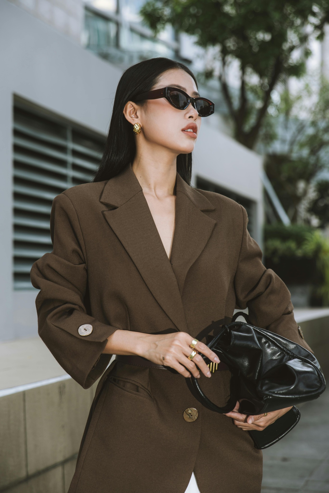 Woman in a brown blazer outfit